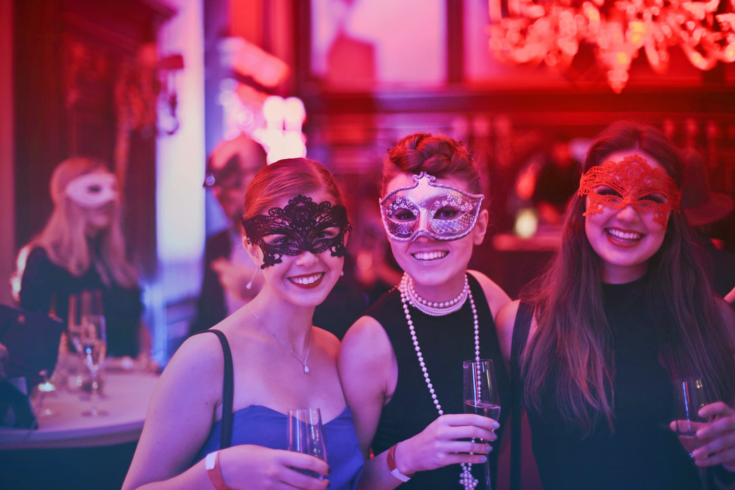 banner pic: women at masquerade party