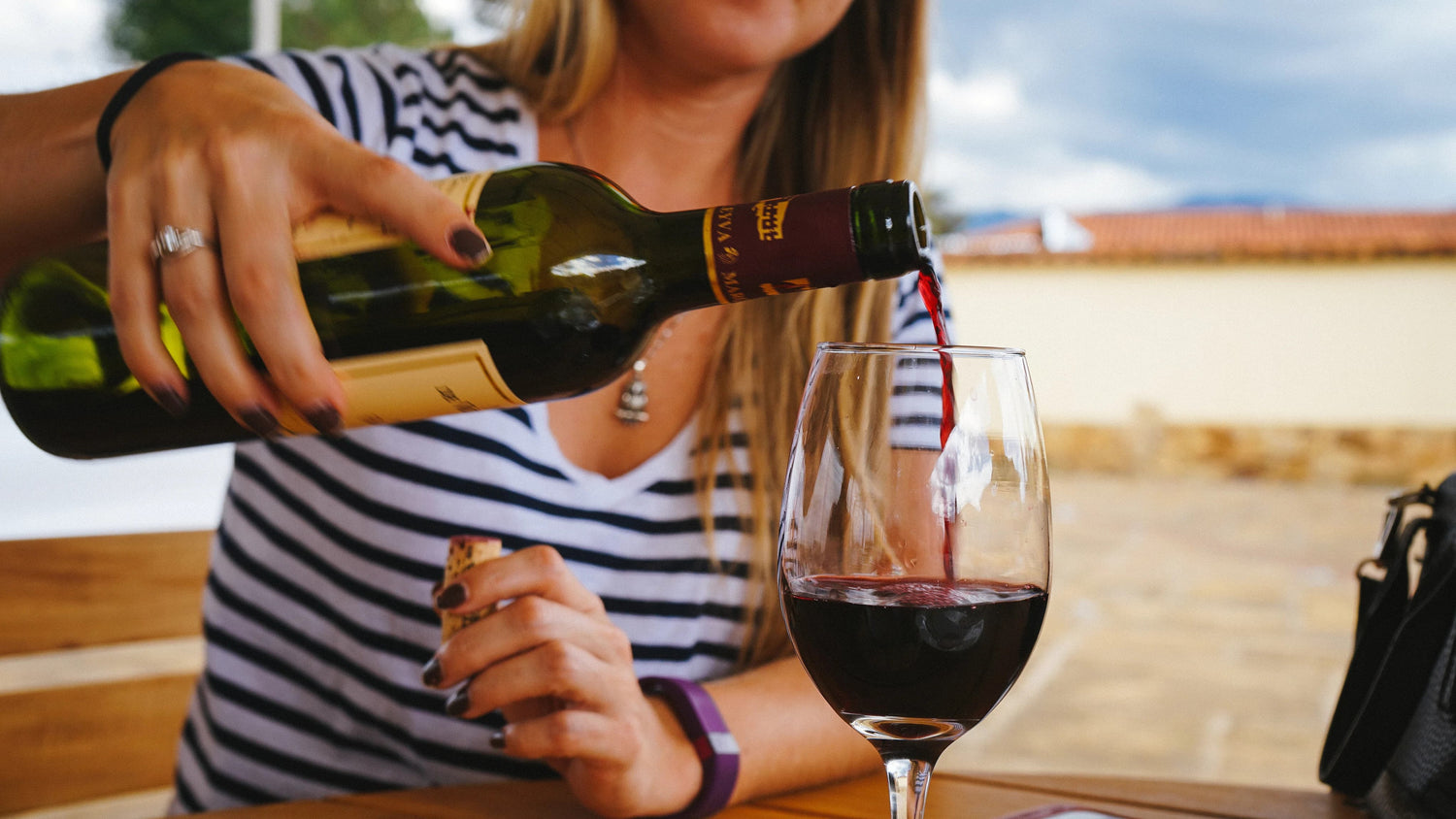 banner pic: woman pouring wine